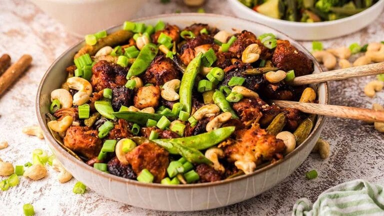 Slow cooker chicken with chopsticks.
