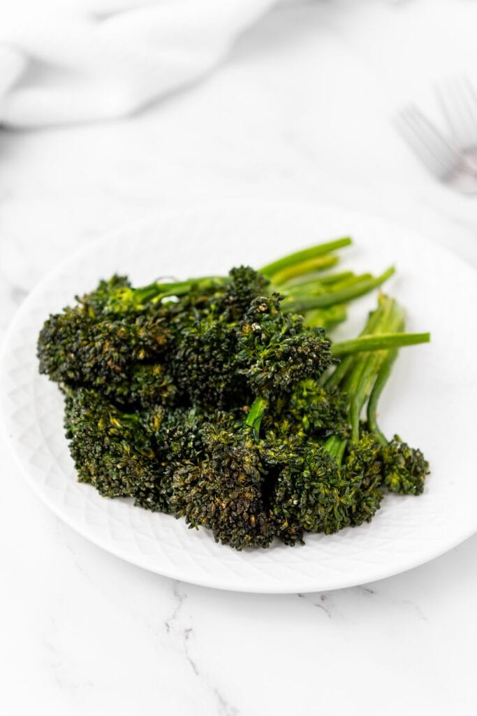 air fryer broccolini on a white plate