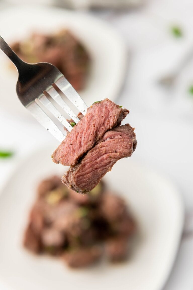 two bites of steak on a fork