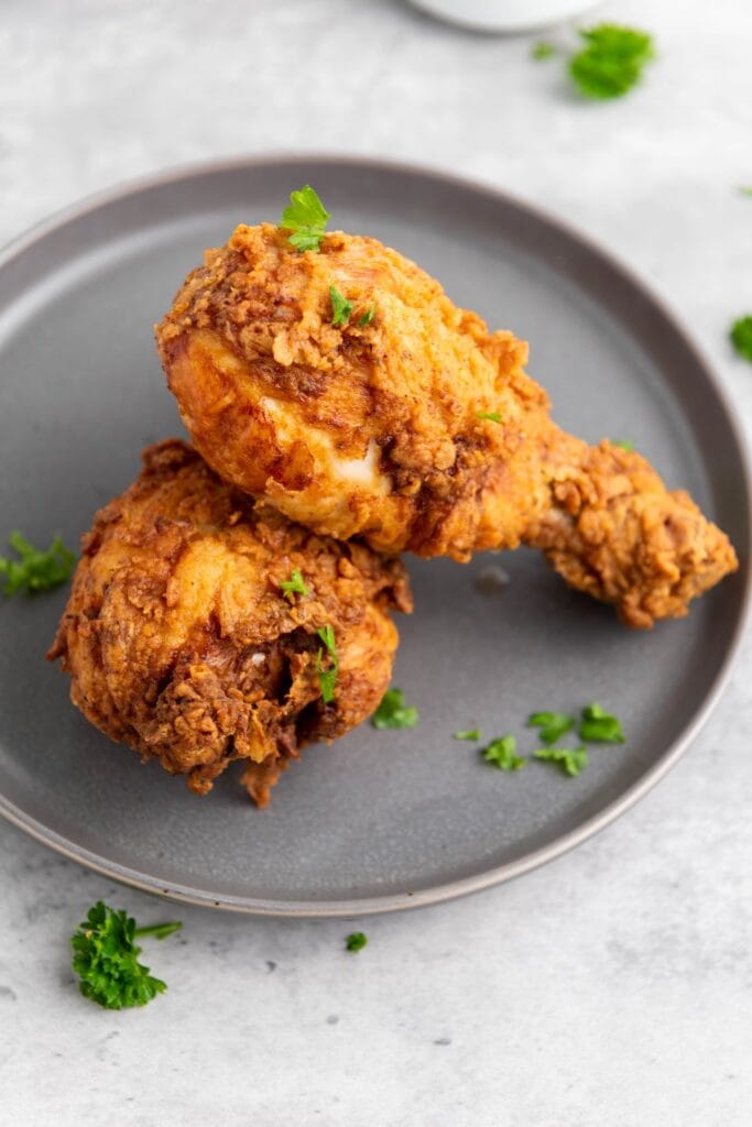 buttermilk fried chicken legs on a plate
