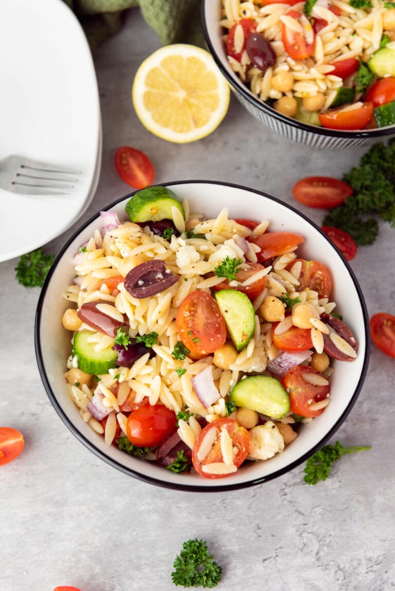 orzo salad with tomatoes in a bowl