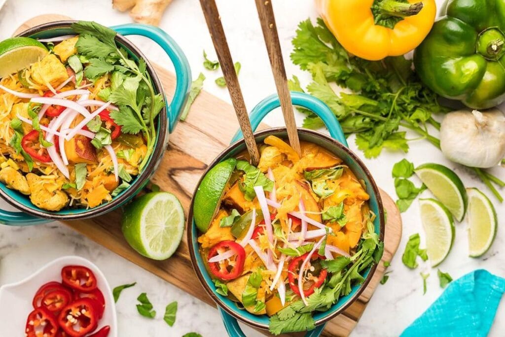 Flavourful Red Curry Thai Coconut Chicken Soup with Sweet Potatoes and Peppers.