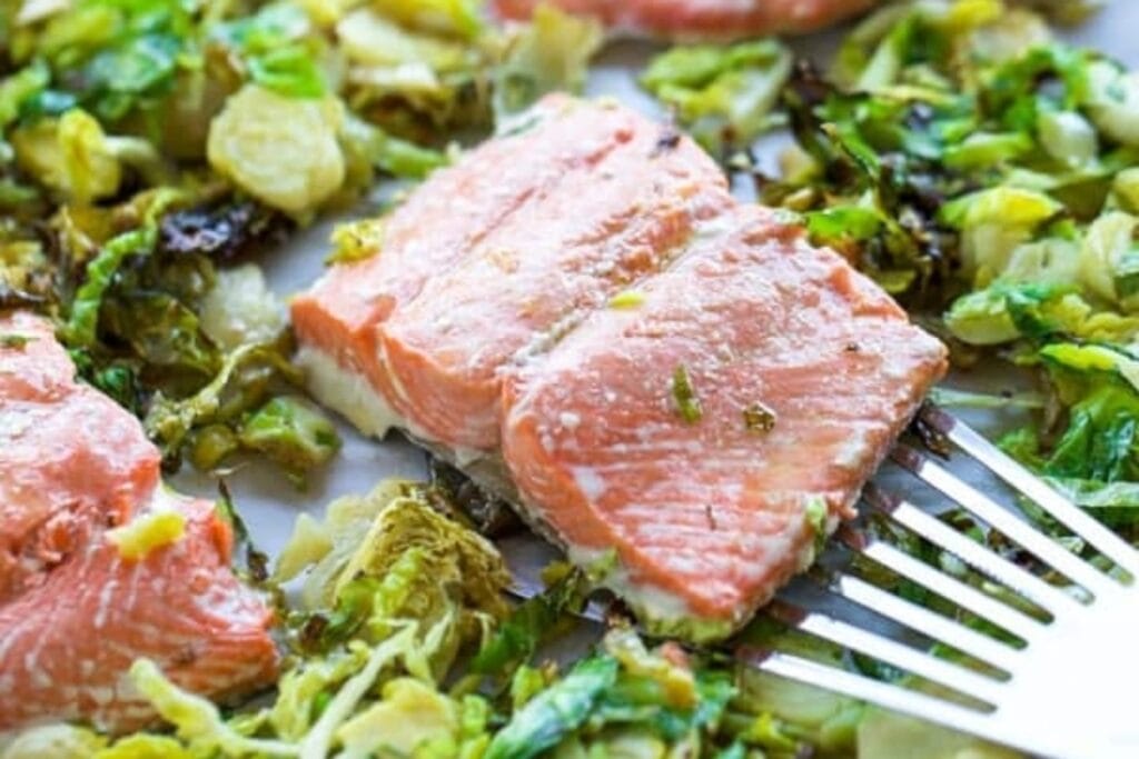 Sheet pan salmon with shaved Brussels sprouts.