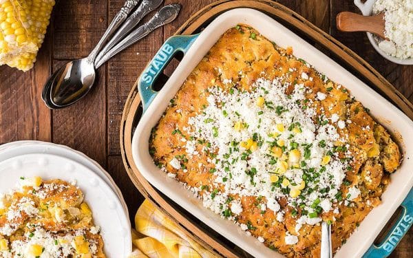 Air fryer corn casserole in a white baking dish.