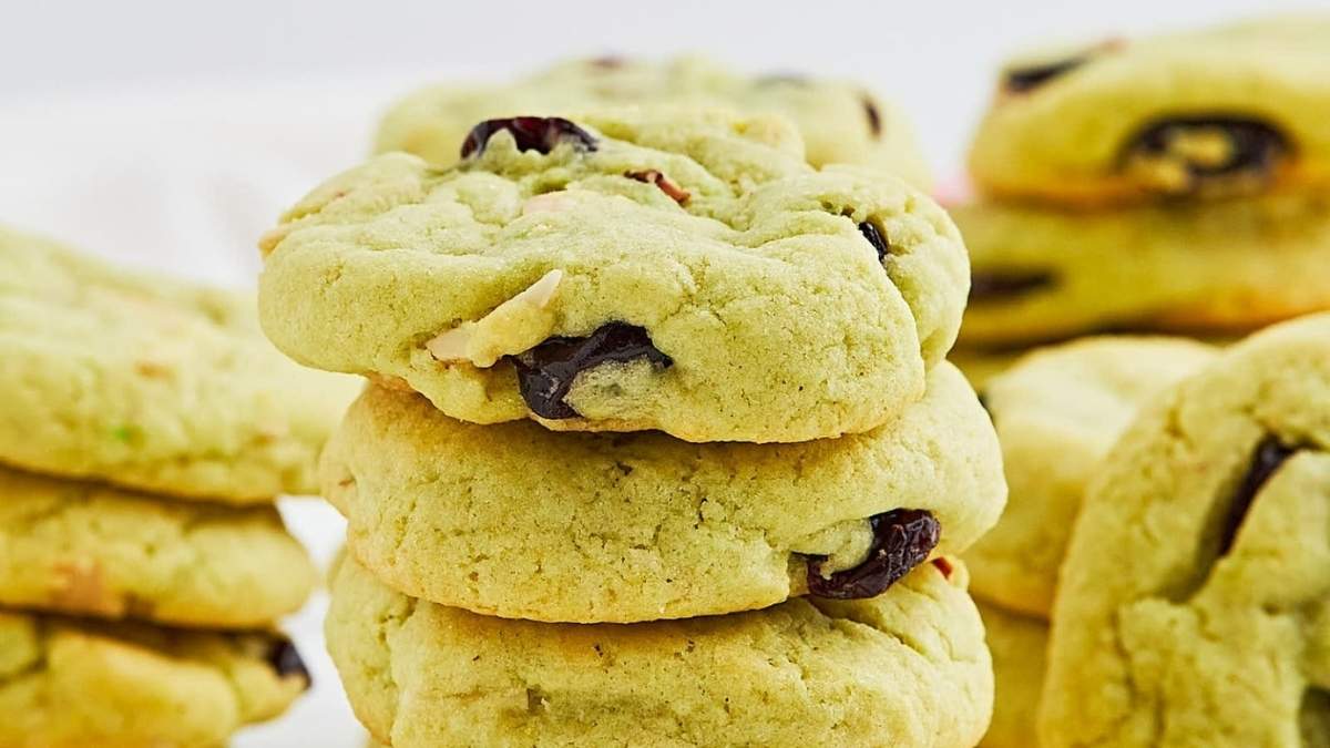 A stack of green cookies with cranberries on top, perfect for your next cookie recipe.