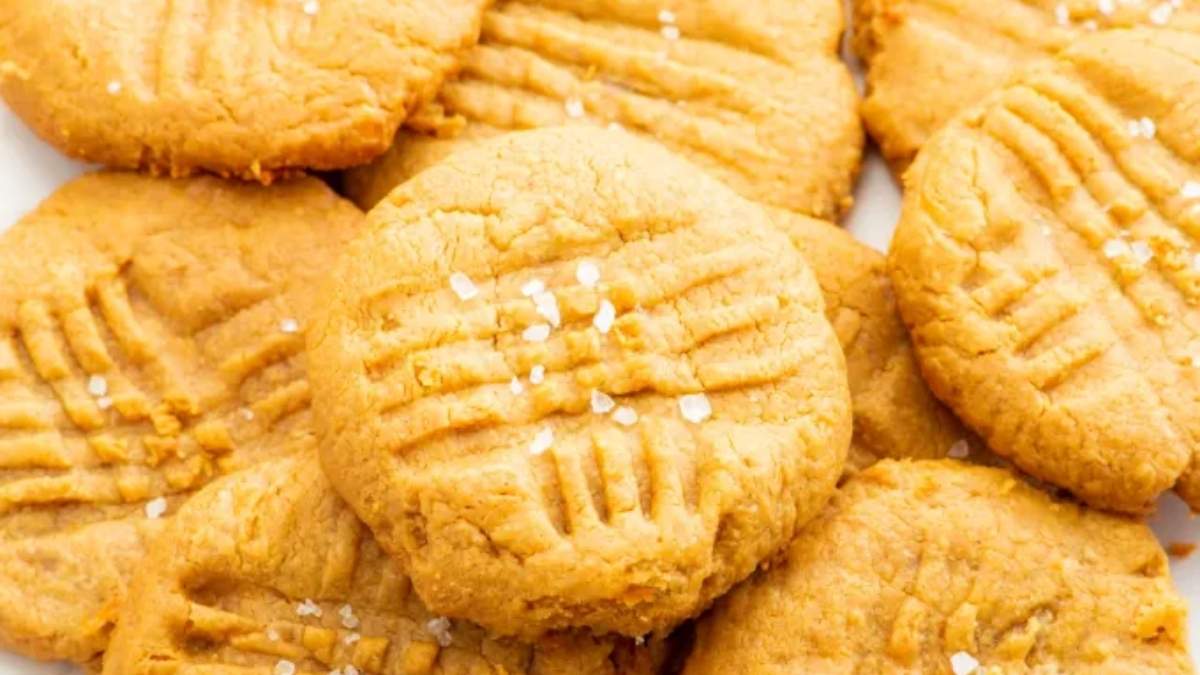 Peanut butter cookies on a shared white plate.