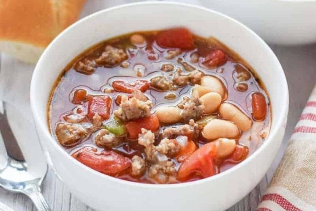 Bowl of sausage and bean soup.
