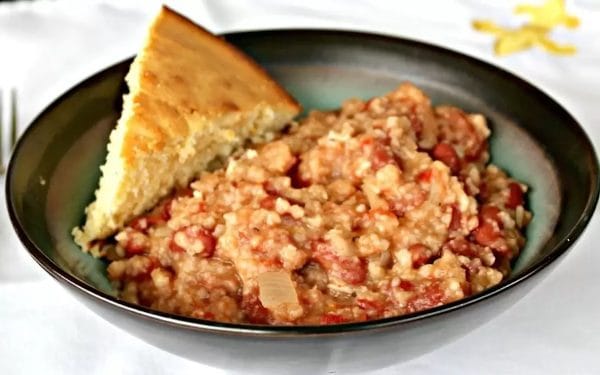 Red beans and rice in a black bowl. 