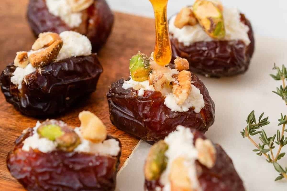 Dates topped with feta cheese and sprigs of thyme, perfect as appetizers.