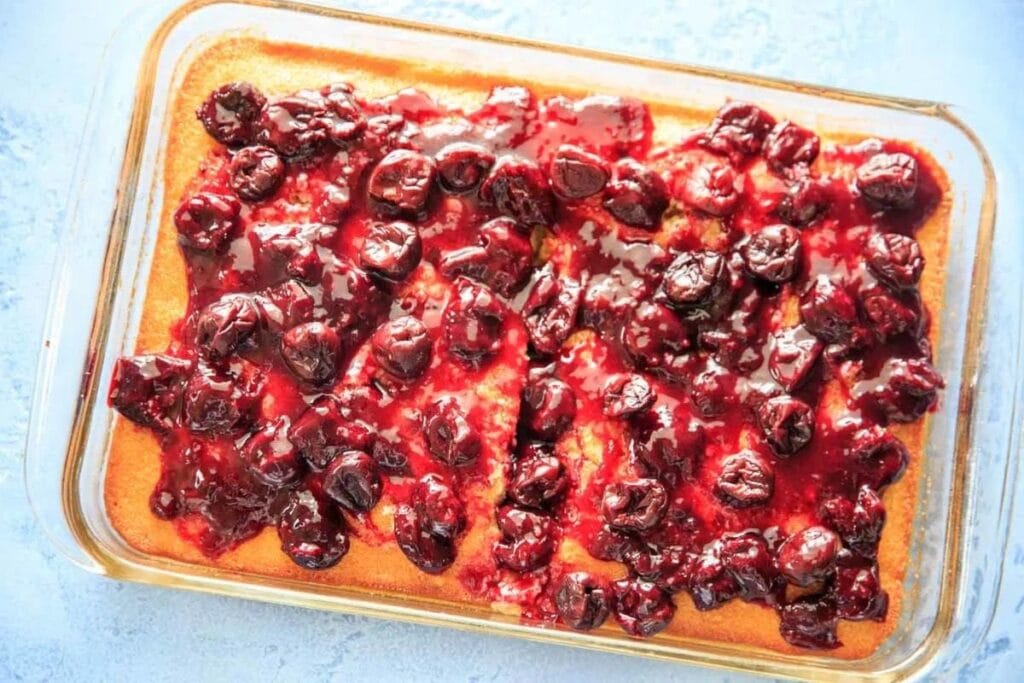 White Sheet Cake With Cherry Glaze Topping.