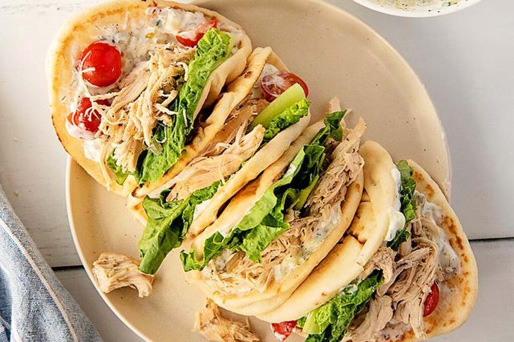Slow Cooker Greek Chicken Gyros with Homemade Tzatziki Sauce.