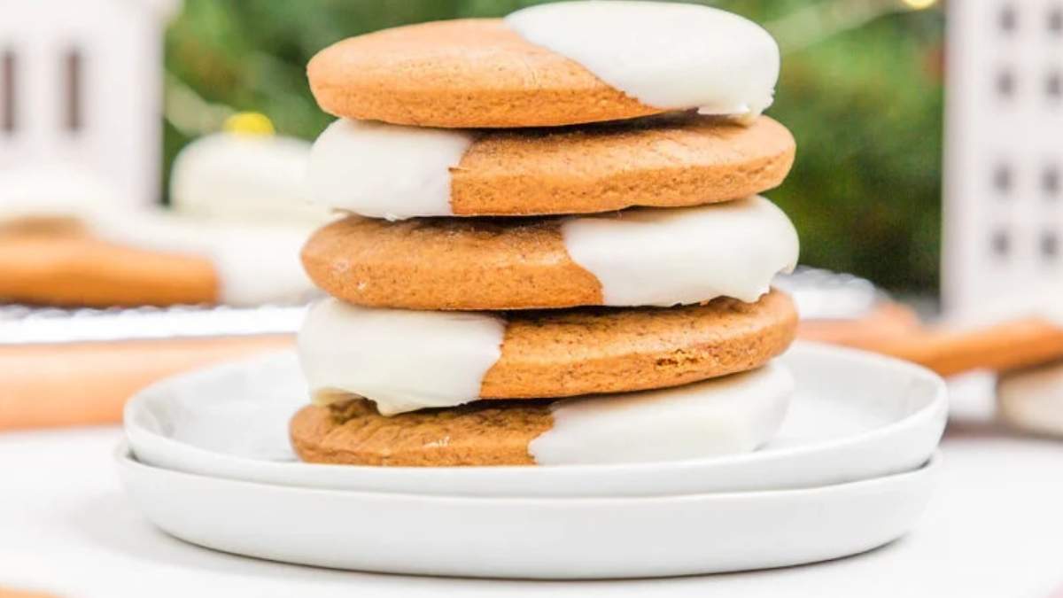 A stack of ginger cookies with icing on top, perfect for those seeking delicious cookie recipes.