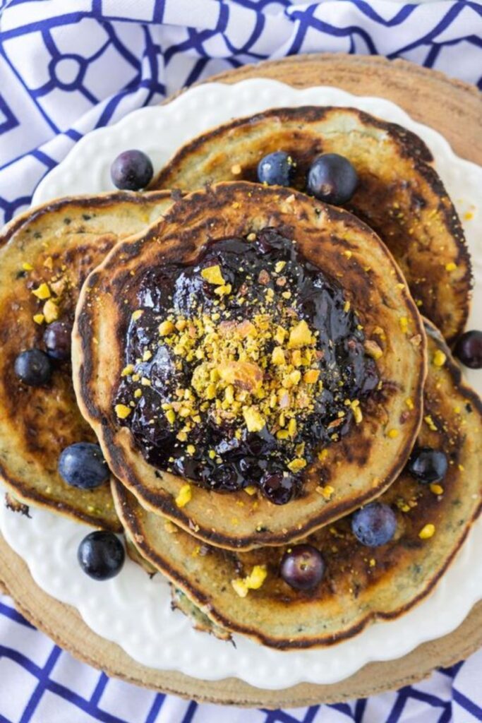 Pancakes with blueberries on top.