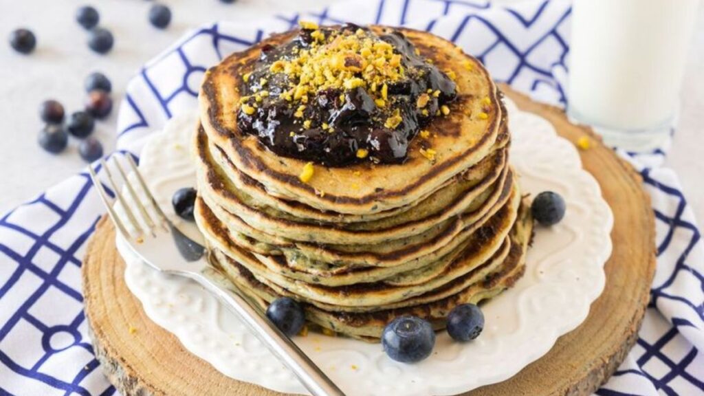 Stack of pancakes with blueberries.