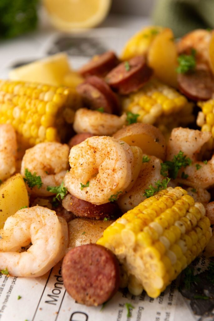 Close up shot of boiled shrimp and corn.