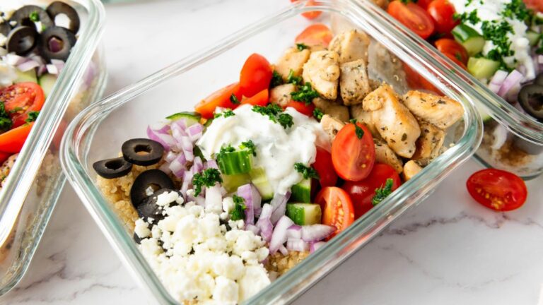 Chicken with quinoa on a glass tray.