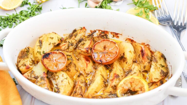 Potatoes with sliced lemons.